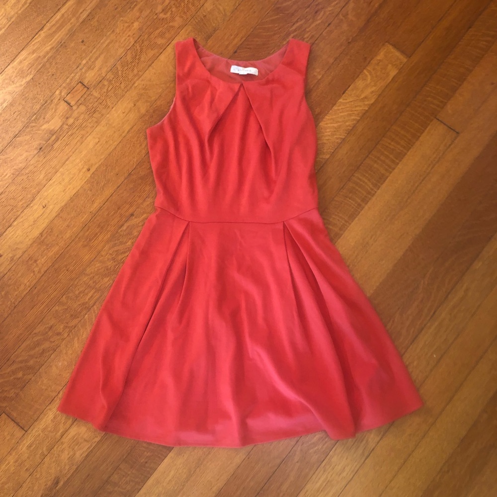 Women’s orange pleated dress